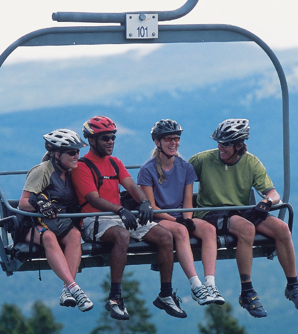 mountain bikers on chair lift