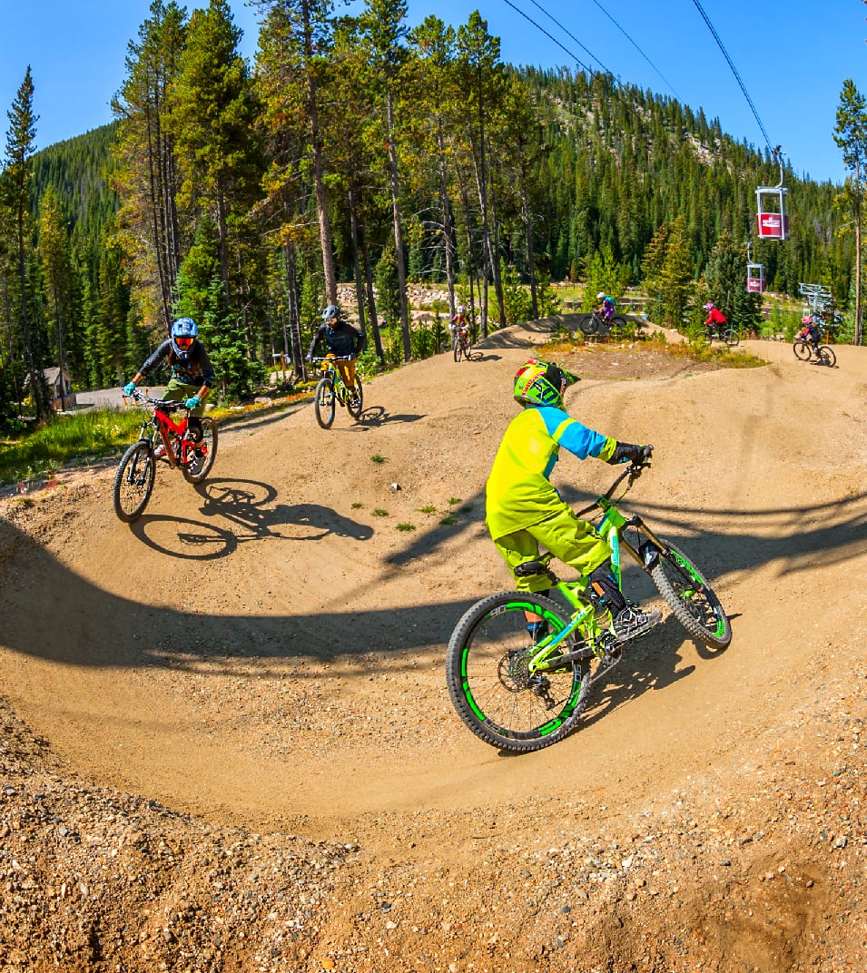 mountain bikers on pump track
